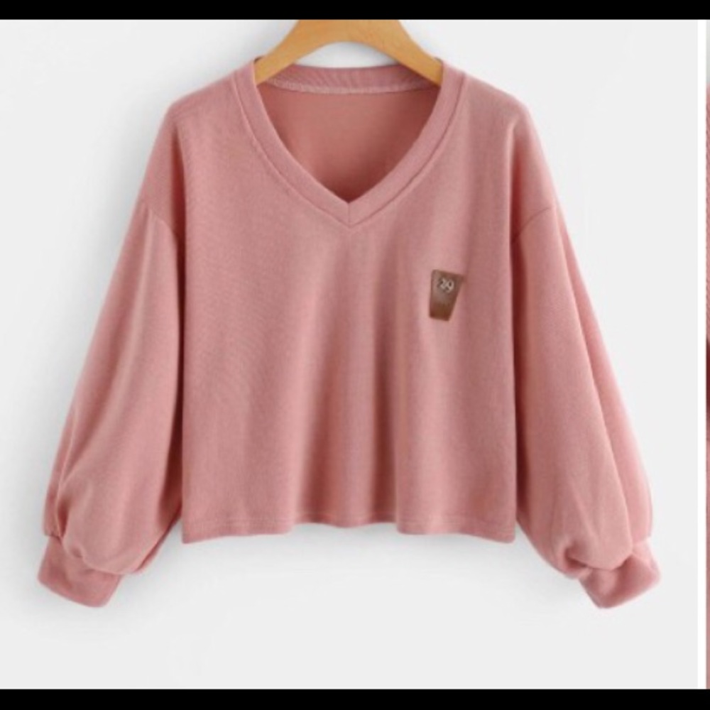 A pink ROMWE sweater